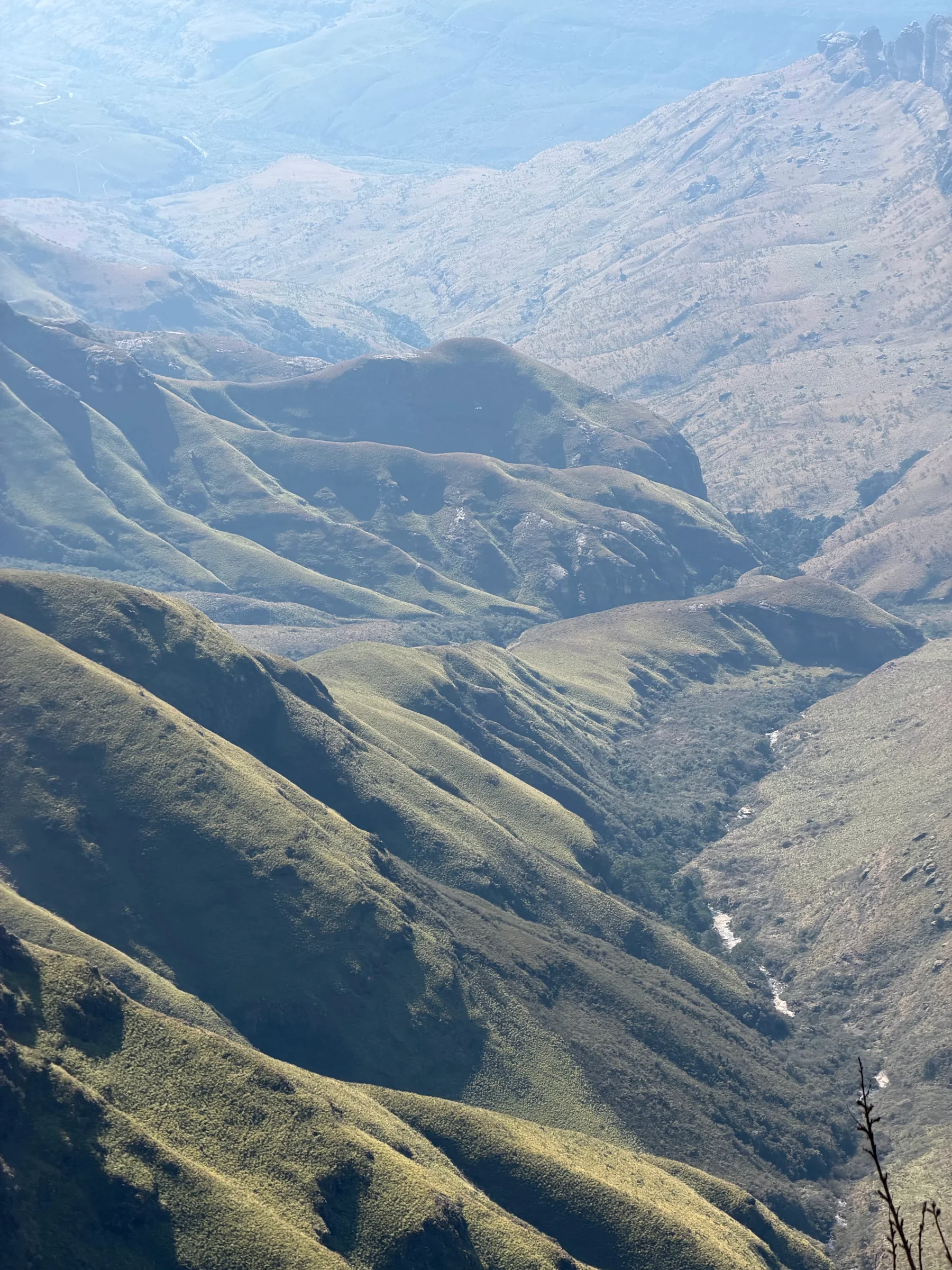 A river winding between folded mountain slopes